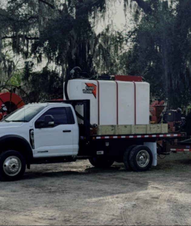 Support truck with a water tank on a job site